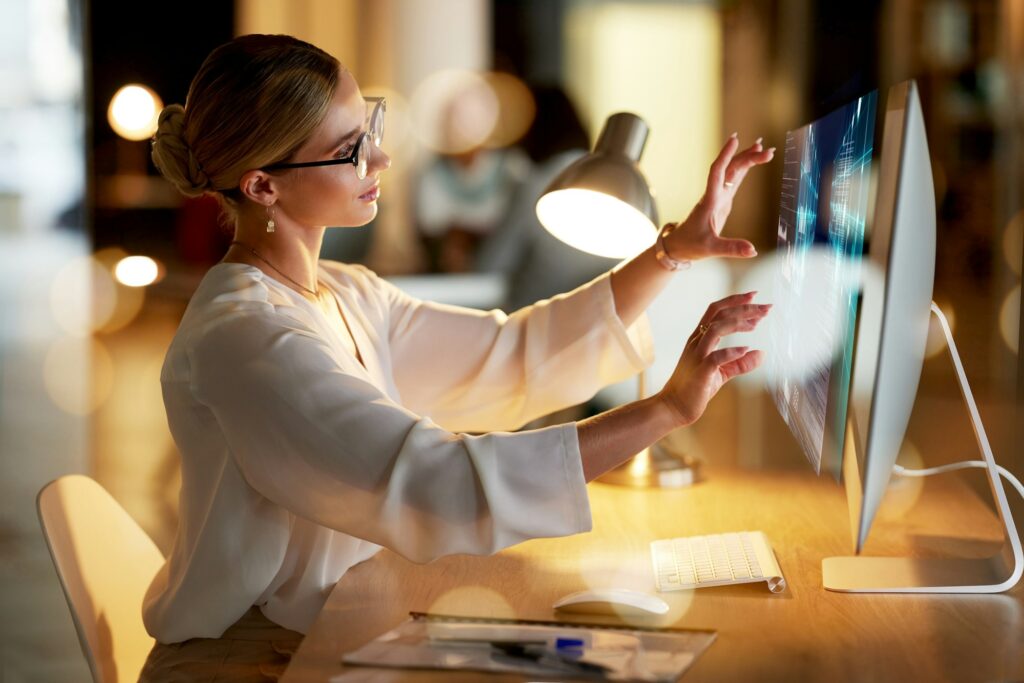 Woman, computer or hologram screen touch in night office, finance planning or investment management